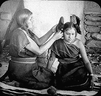 Hopi Woman Placing Ornaments in Hair